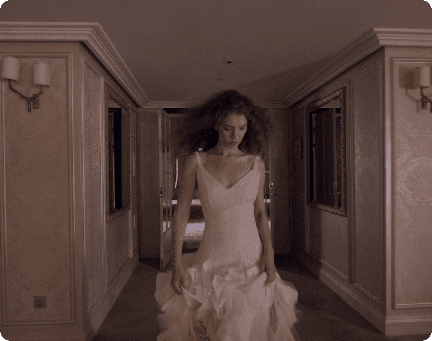 Woman in a white dress in a corridor editorial scene